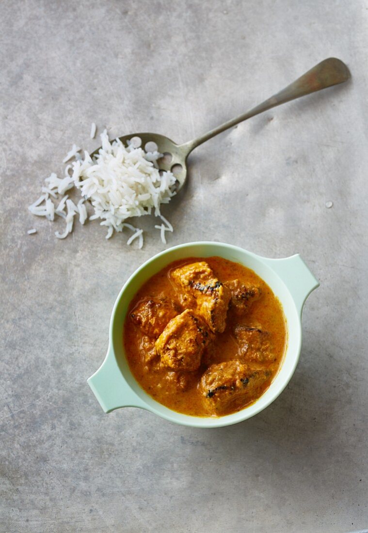 Chicken and coconut curry with a spoonful of rice