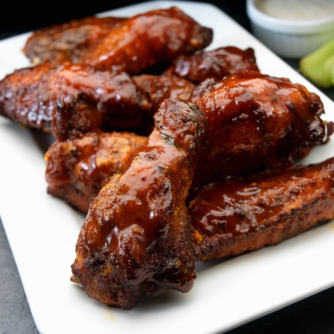 Smoked chicken wings with ranch dressing and celery