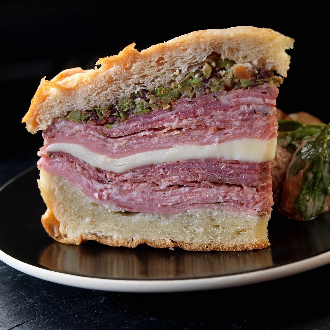 A muffuletta sandwich with olive tapenade