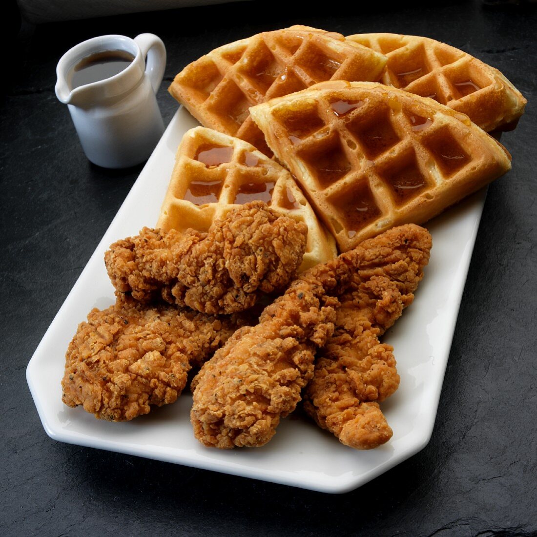 Fried chicken in breadcrumbs with syrup waffles