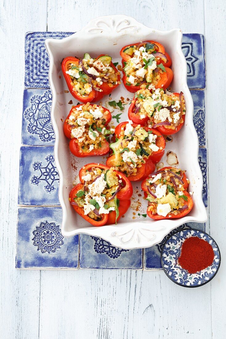 Red peppers filled with lentils, courgette and feta