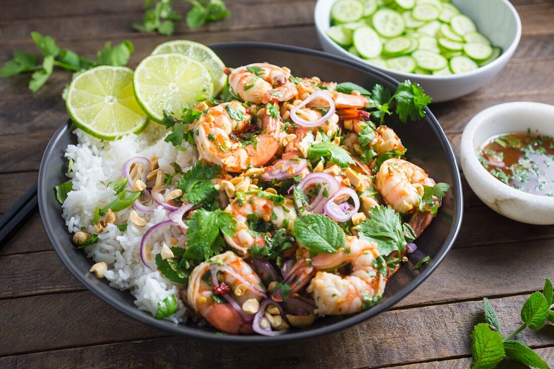 Prawns with rice, herbs, peanuts and lime