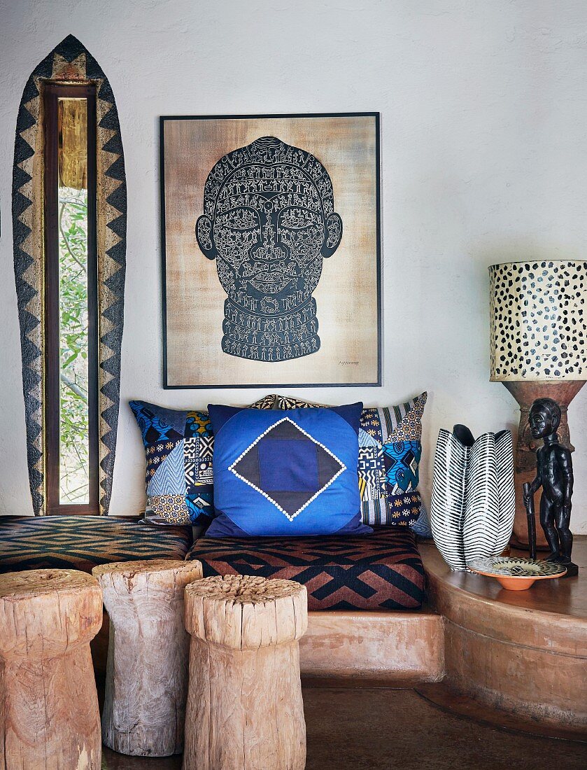 Ethnic living room with masonry bench and patterned cushions