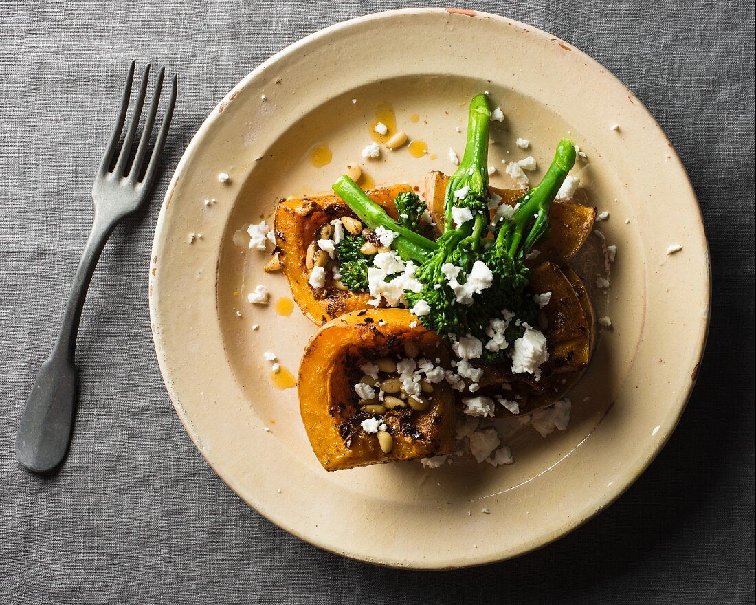 Roasted butternut squash with broccoli, feta and pine nuts