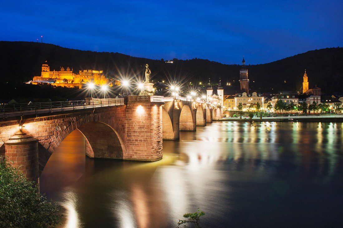 The Old Bridge lit up at night in Heidelberg in the Hessische Bergstrasse wine region of Germany