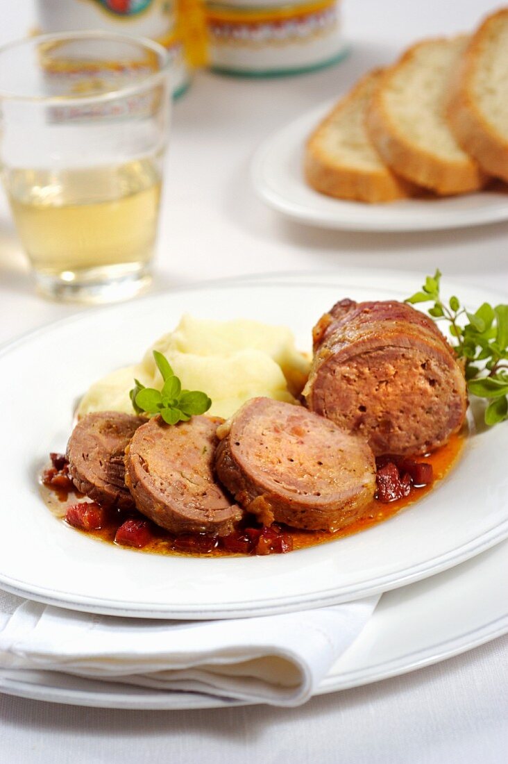 Veal roulade wrapped in prosciutto and served with potato purée