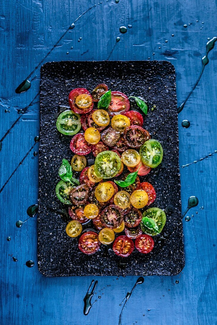Coloured tomato salad with balsamic vinegar (seen from above)