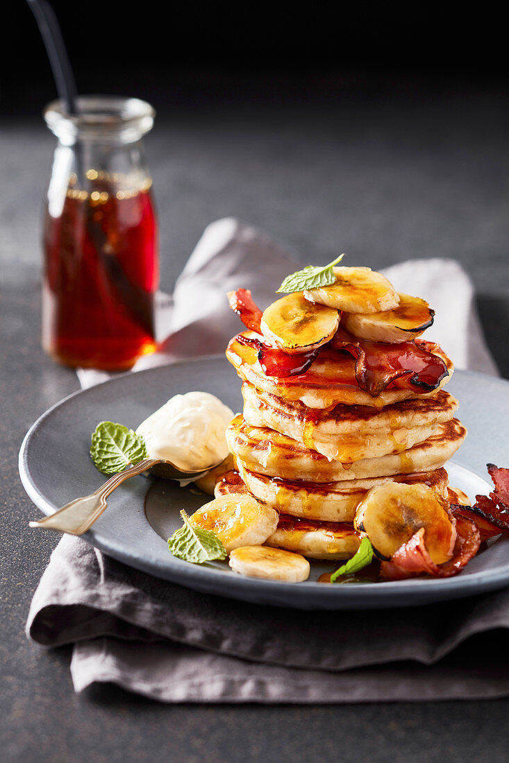 Fried banana, bacon and ricotta flapjack stack