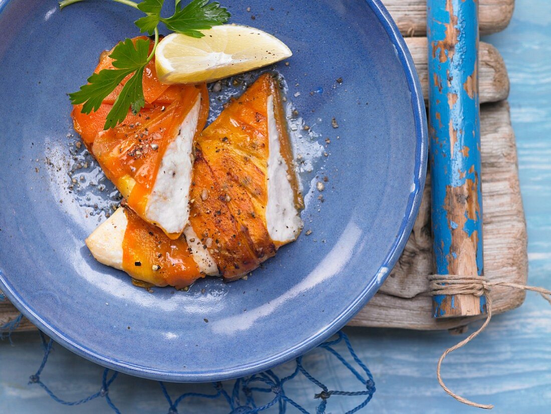 Baked plaice fillet wrapped in carrot