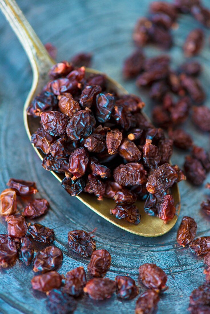 Dried Persian berberis berries on an antique Indian spoon