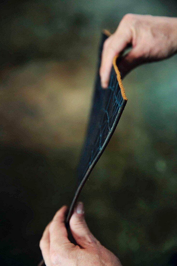 Leather being prepared at the 'Ludwig Schroeder' leather workshop in Kanten, Germany