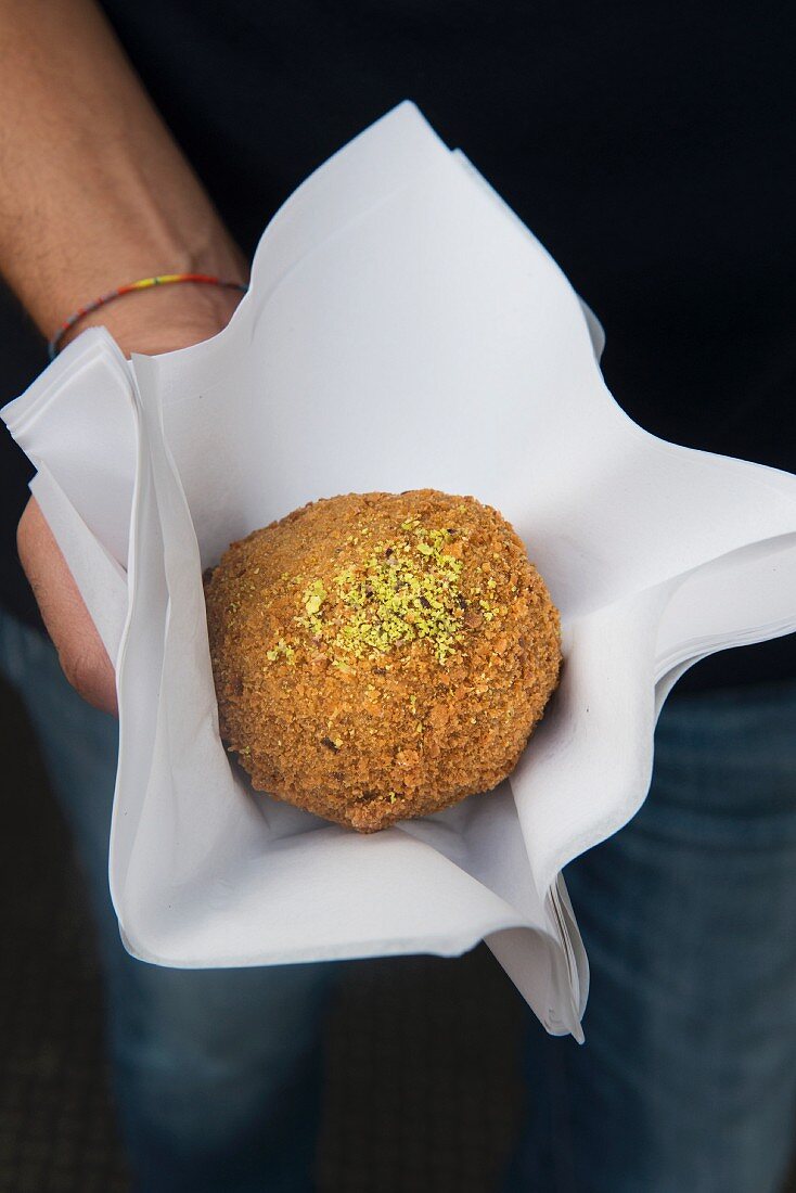 Arancini (rice balls with pistachios) from the Bronte region of Sicily, Italy