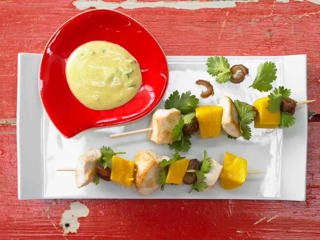Chicken kebabs with mango and curry and coriander yoghurt
