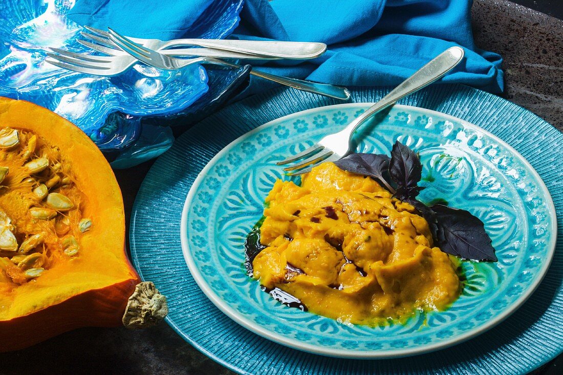 Vegan pumpkin purée with pumpkin seed oil and purple basil