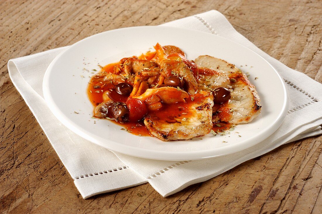 Pork escalopes with olive and tomato sauce