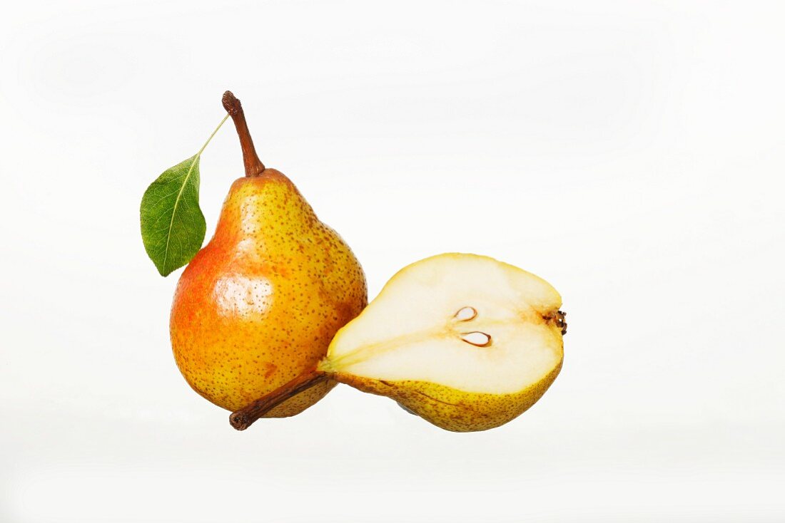 Whole Williams pear and half a pear