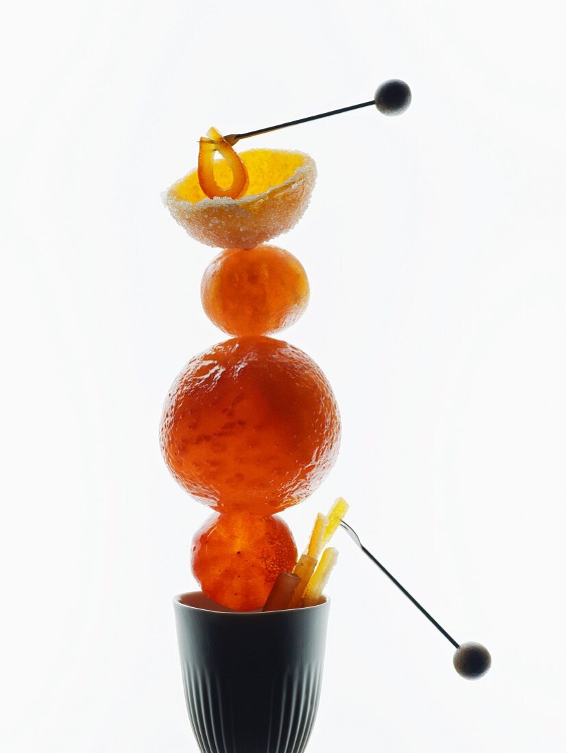 Candied citrus fruits stacked in a cup