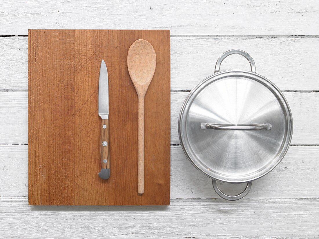 Knife, wooden spoon and saucepan