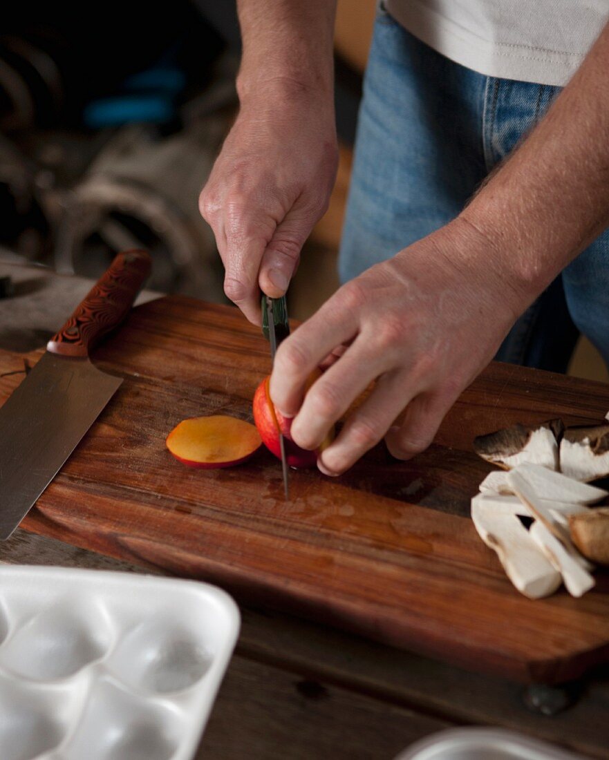 A nectarine being cut