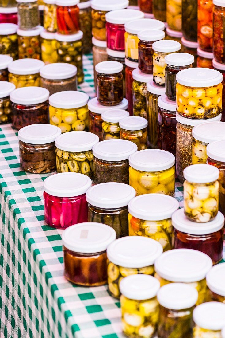 Pickle vegetables in glass jars on a market stand in Beirut, Lebanon