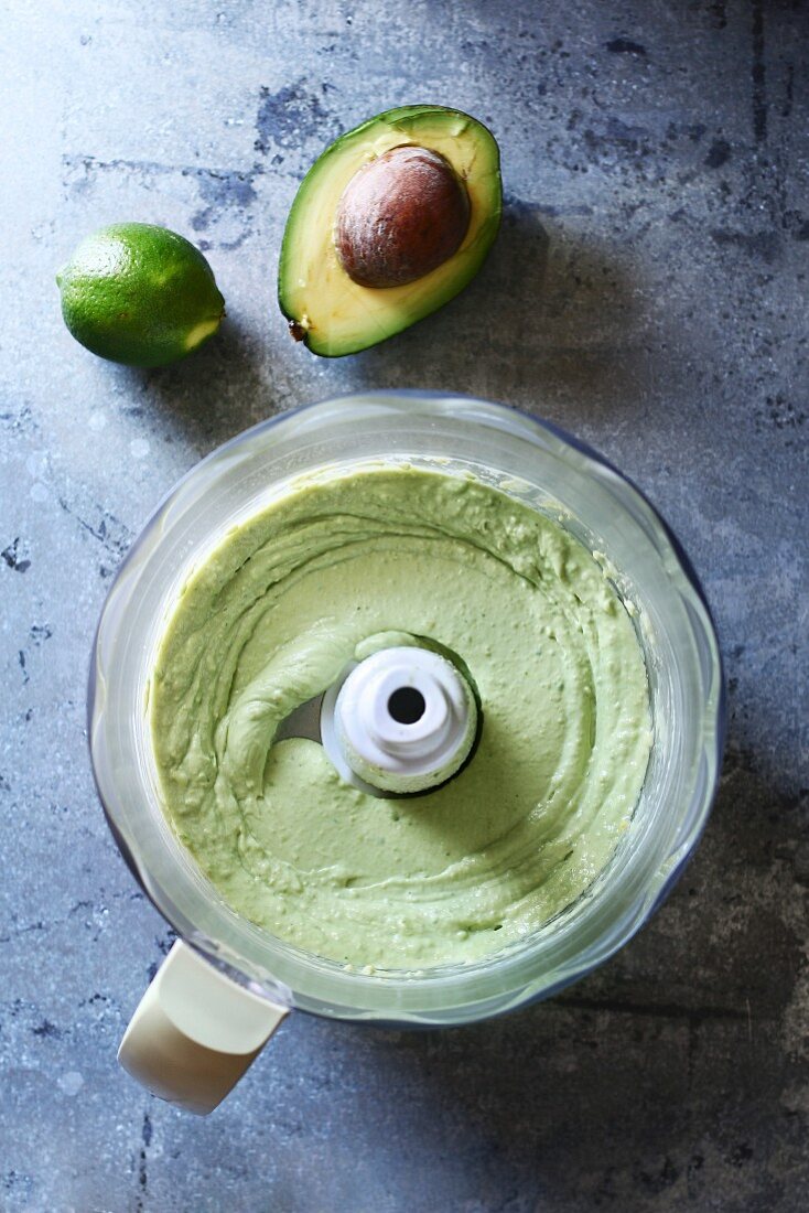 Avocado and lime dressing in a food processor