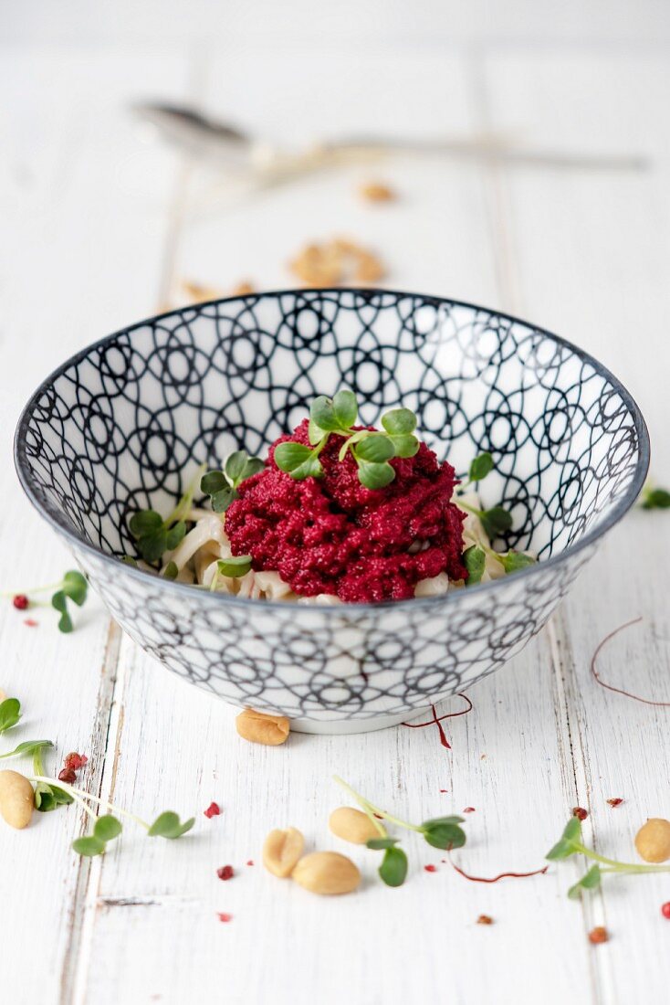 Beetroot and peanut pesto with pasta and large-leaf cress