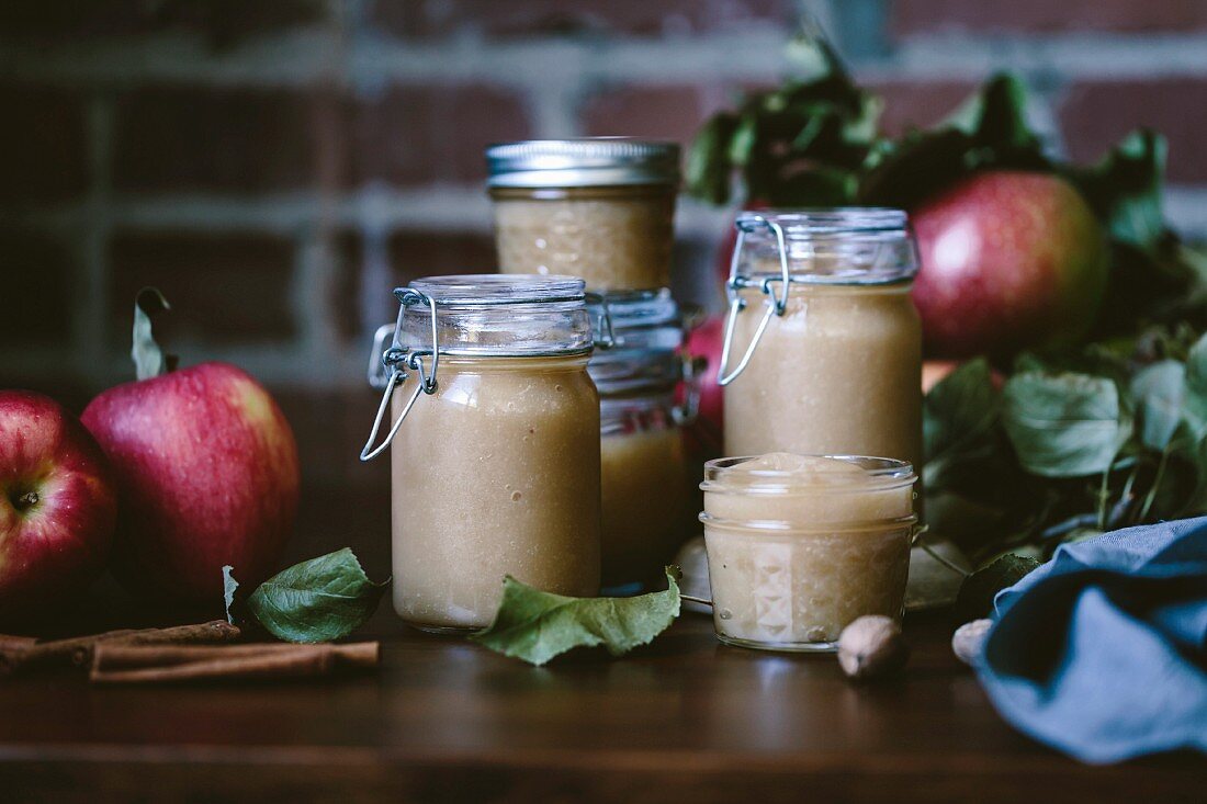 Glass jars filled with homemade apple sauce