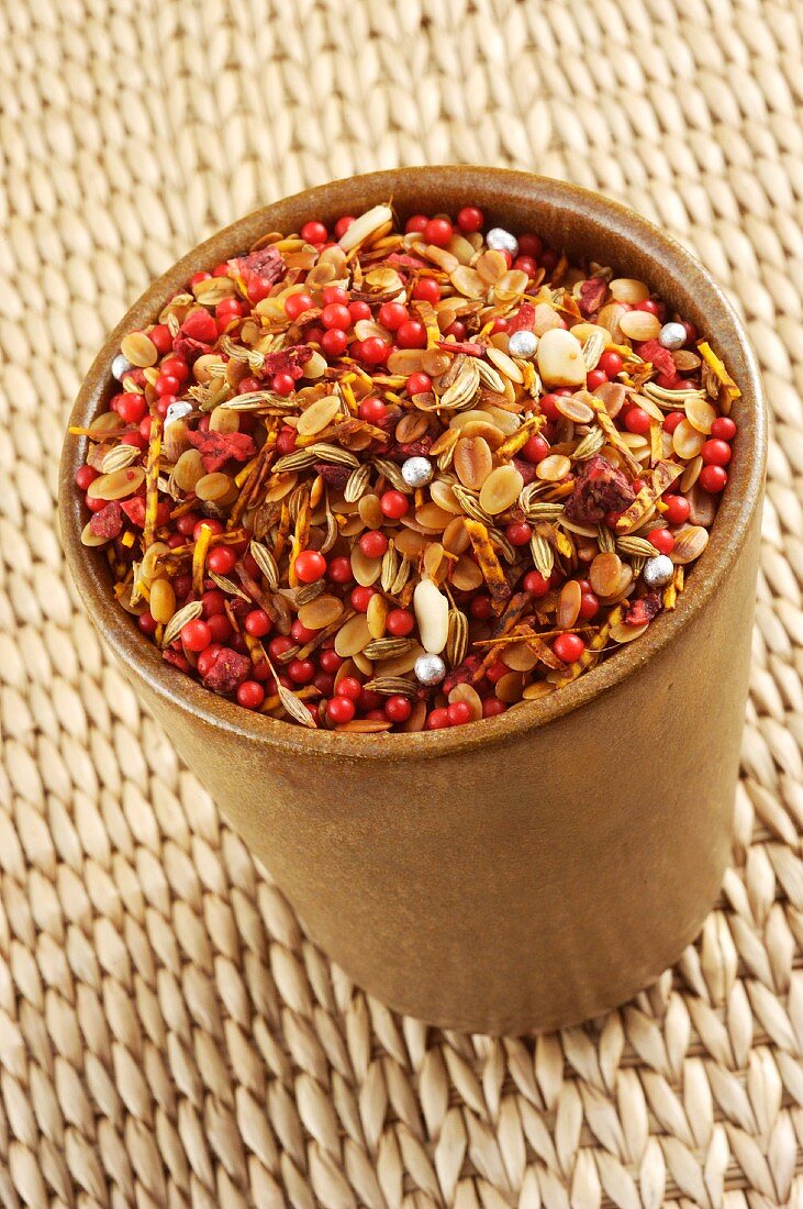 An Indian spice mixture in a ceramic cup