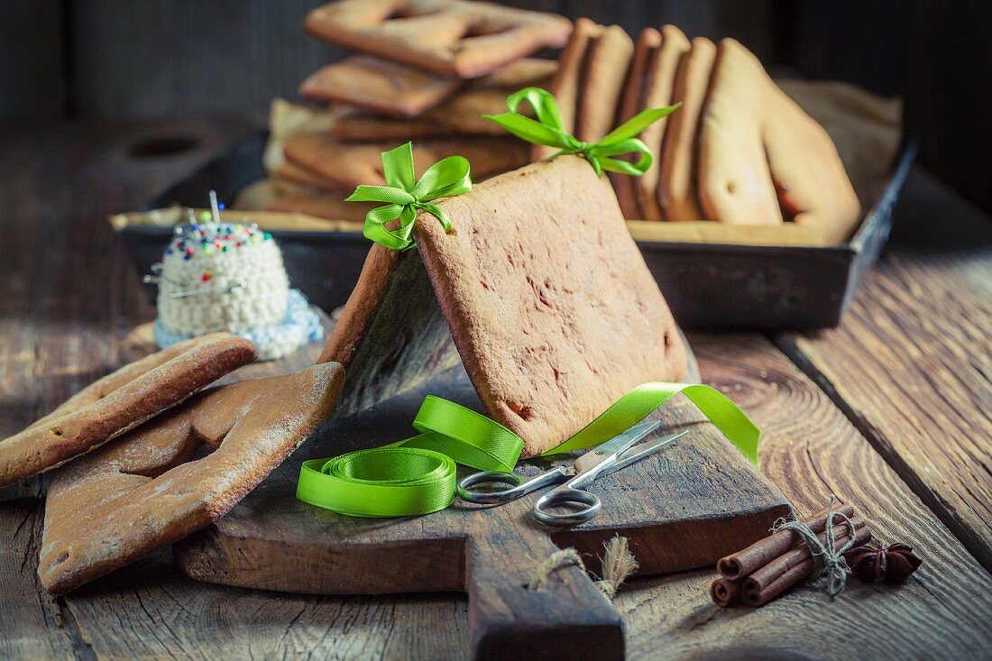 A gingerbread house being built for Christmas