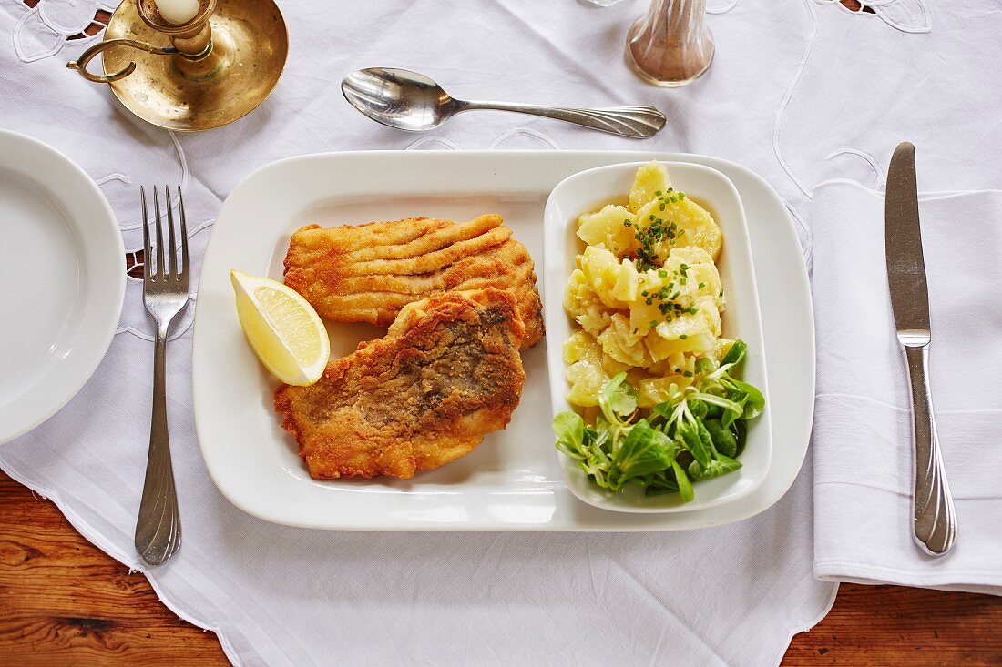 Baked carp with potato and lamb's lettuce