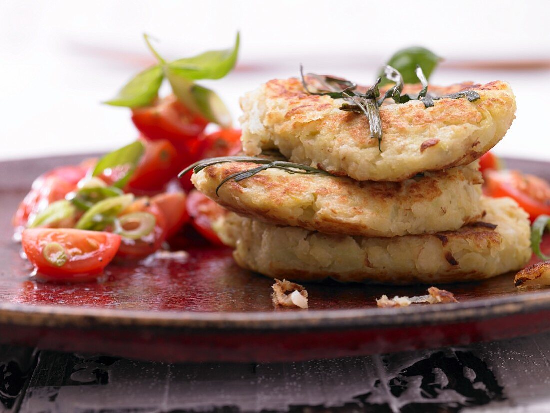 Potato and kohlrabi fritters with a tomato salad