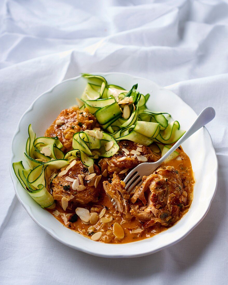 Chicken legs in paprika and white wine sauce with courgette ribbons