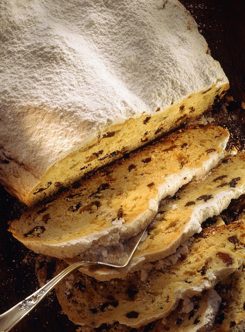 Dresden stollen, slices cut, one slice on server