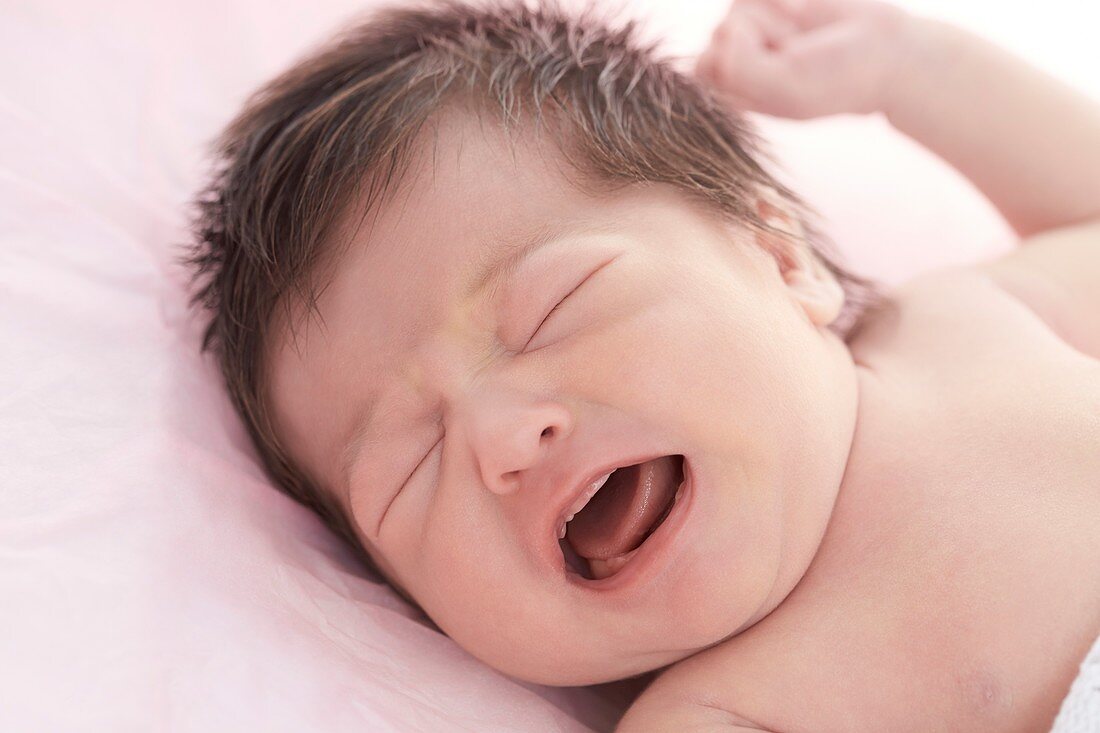 Newborn baby girl with eyes closed