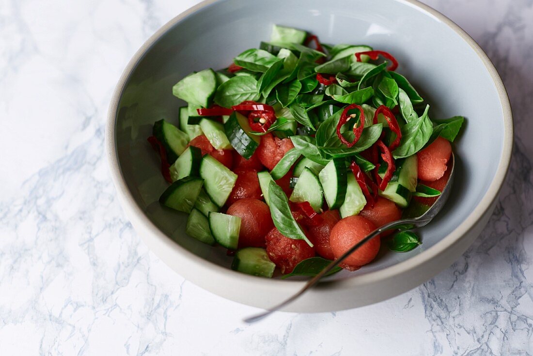 Melon salad with cucumber, chilli and basil