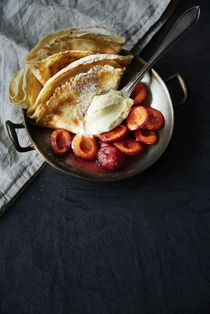 Pancakes with plum compote and vanilla ice cream