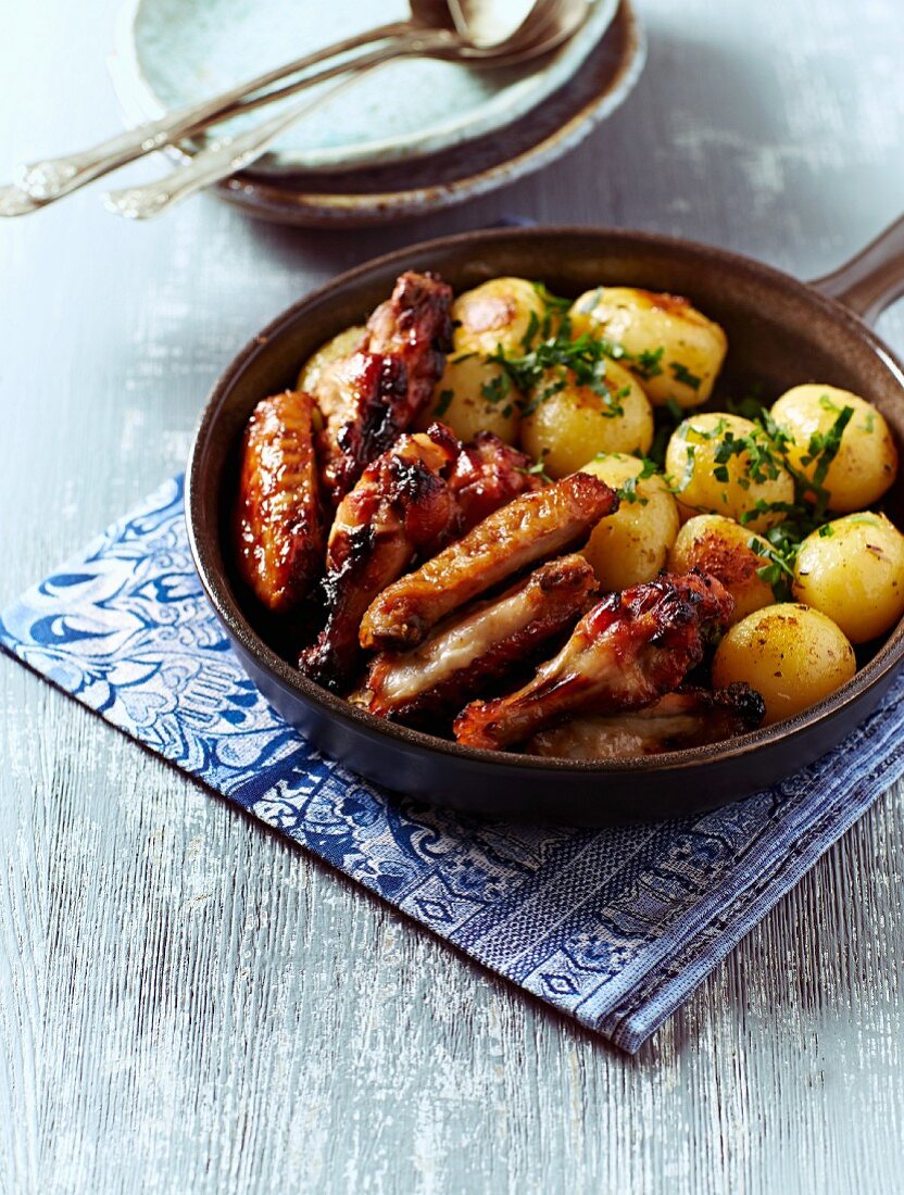 Honey-glazed chicken with oven-baked potatoes