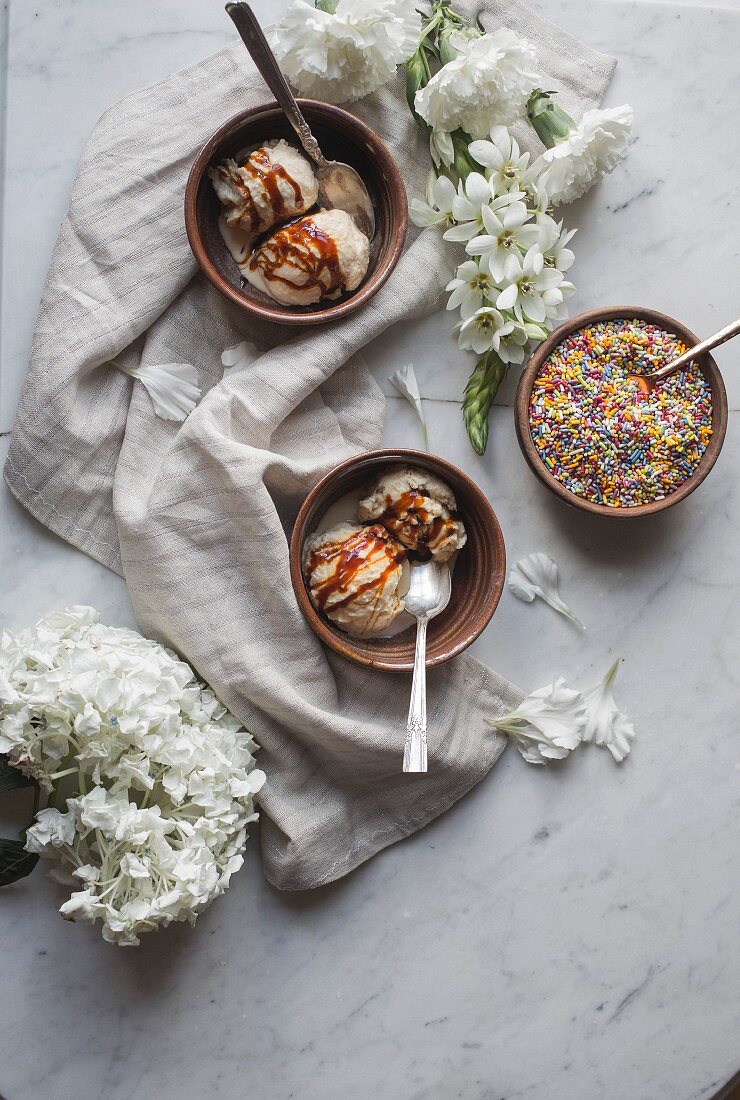 Jaggery ice cream with colourful sprinkles in bowls