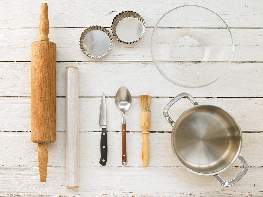 Kitchen utensils for making almond tarts with apricot jam