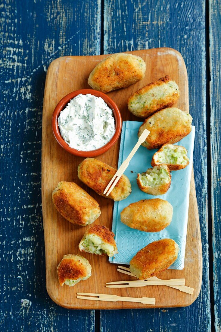 Potato and broccoli croquettes with herb and cream cheese dip