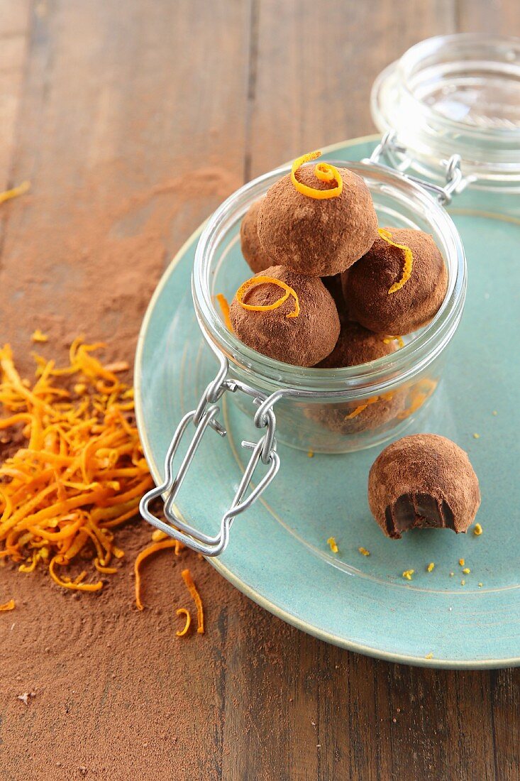 Vegan chocolate and orange truffles in a glass jar