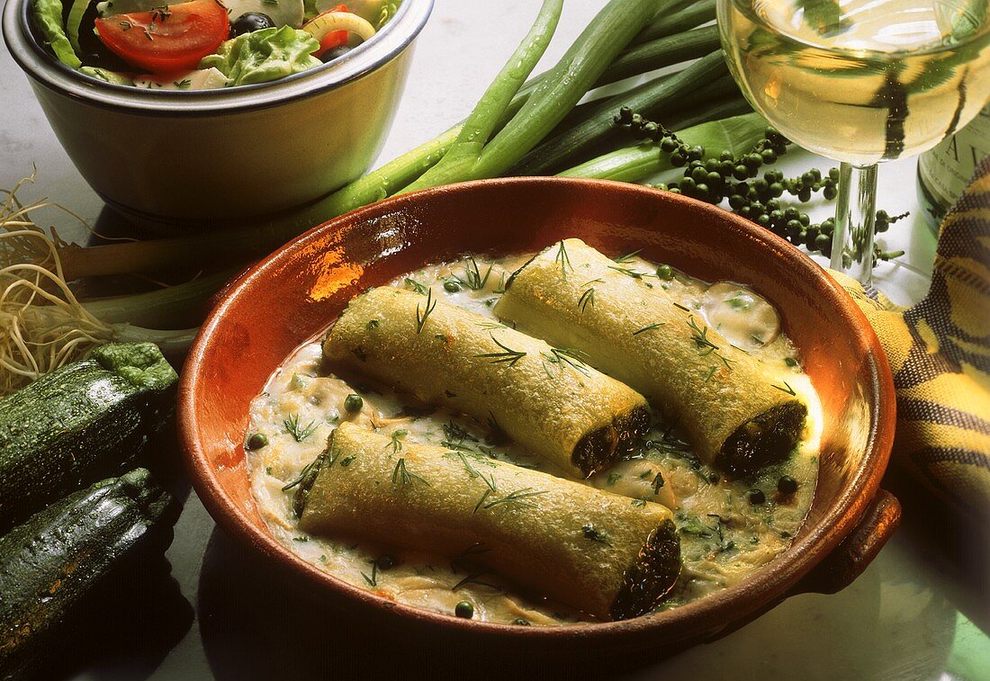 Cannelloni filled with spinach & cheese sauce in round dish