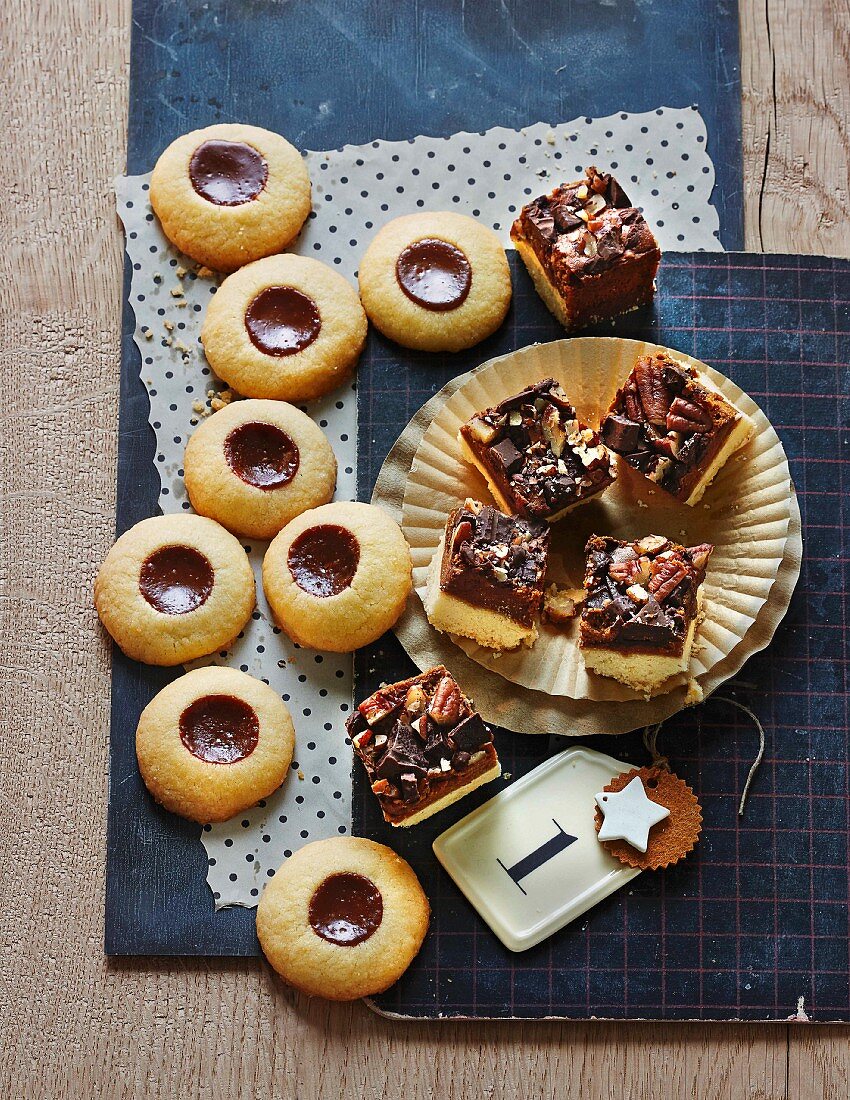Shortbread jam biscuits with dulce de leche and chocolate and caramel squares