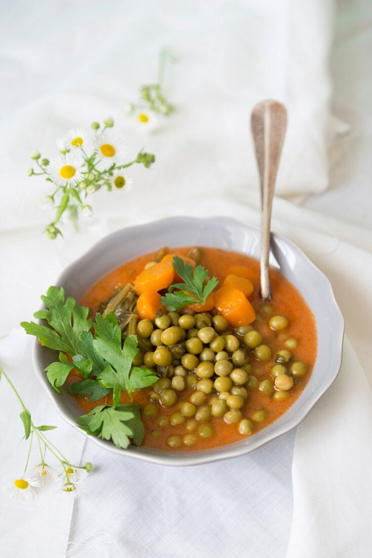 Pea and carrot soup with fresh parsley