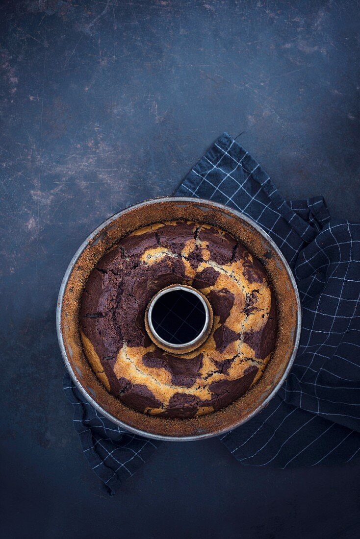 Vegan marble cake in a ring-shaped baking tin