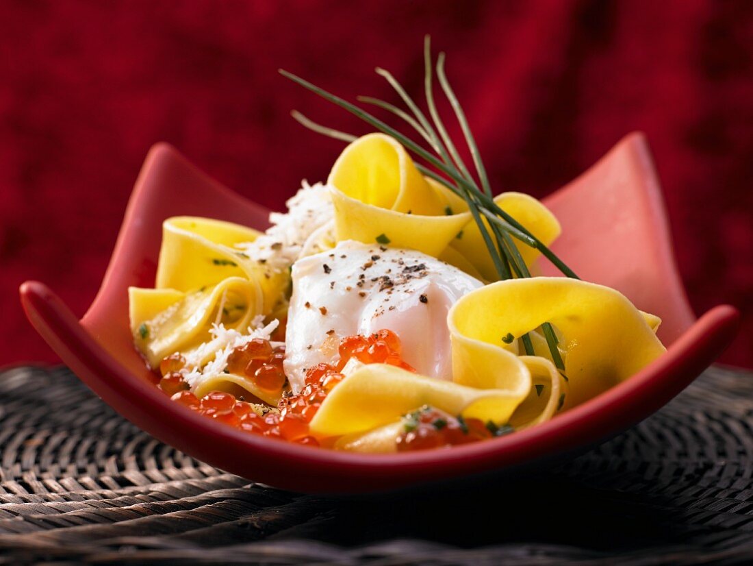 Pasta with a poached egg and caviar