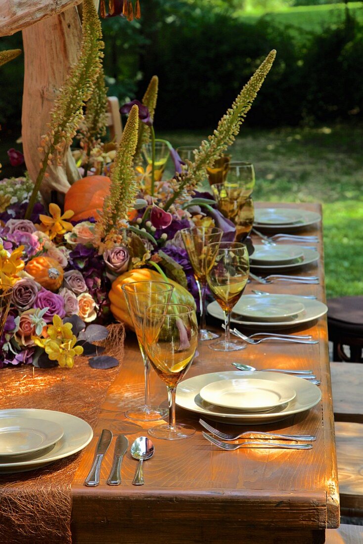 Autumnally set dining table outside barn (USA, East Coast, New England)