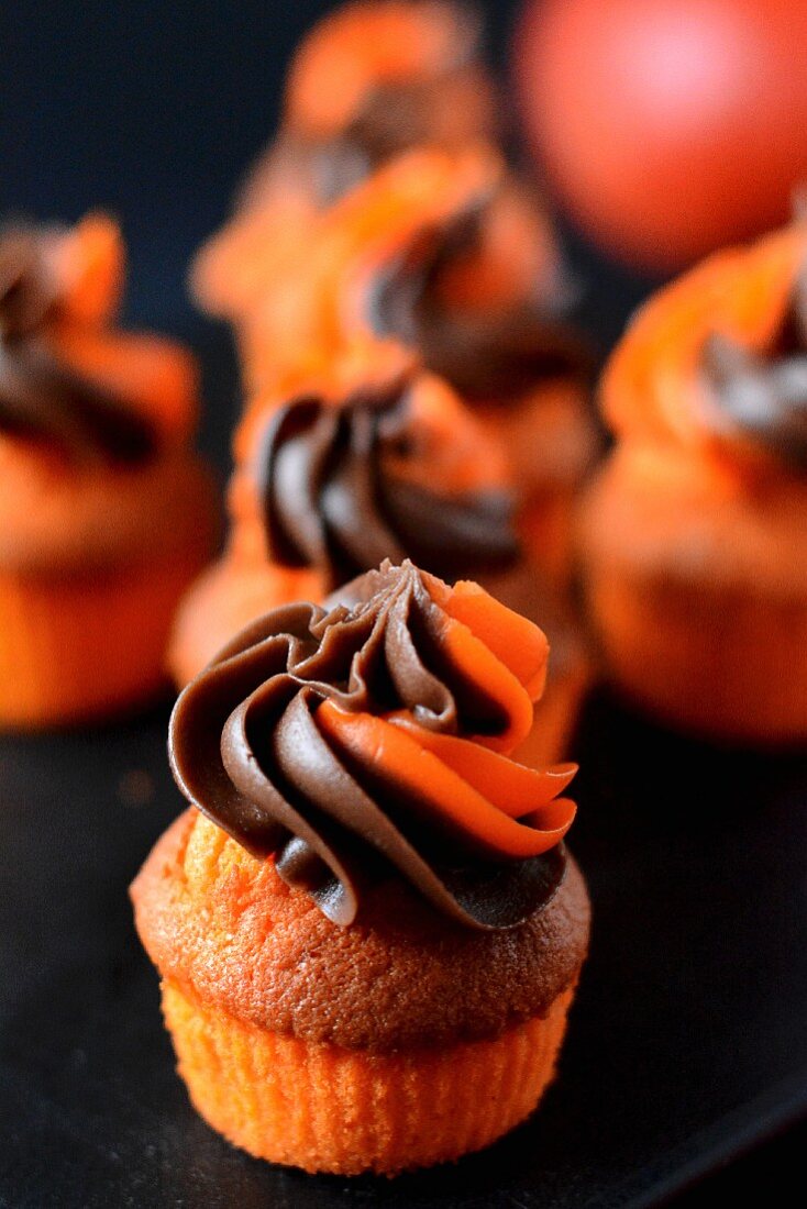 Orange muffins with a chocolate and orange frosting