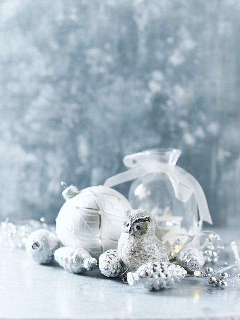 Arrangement of silver and white Christmas decorations