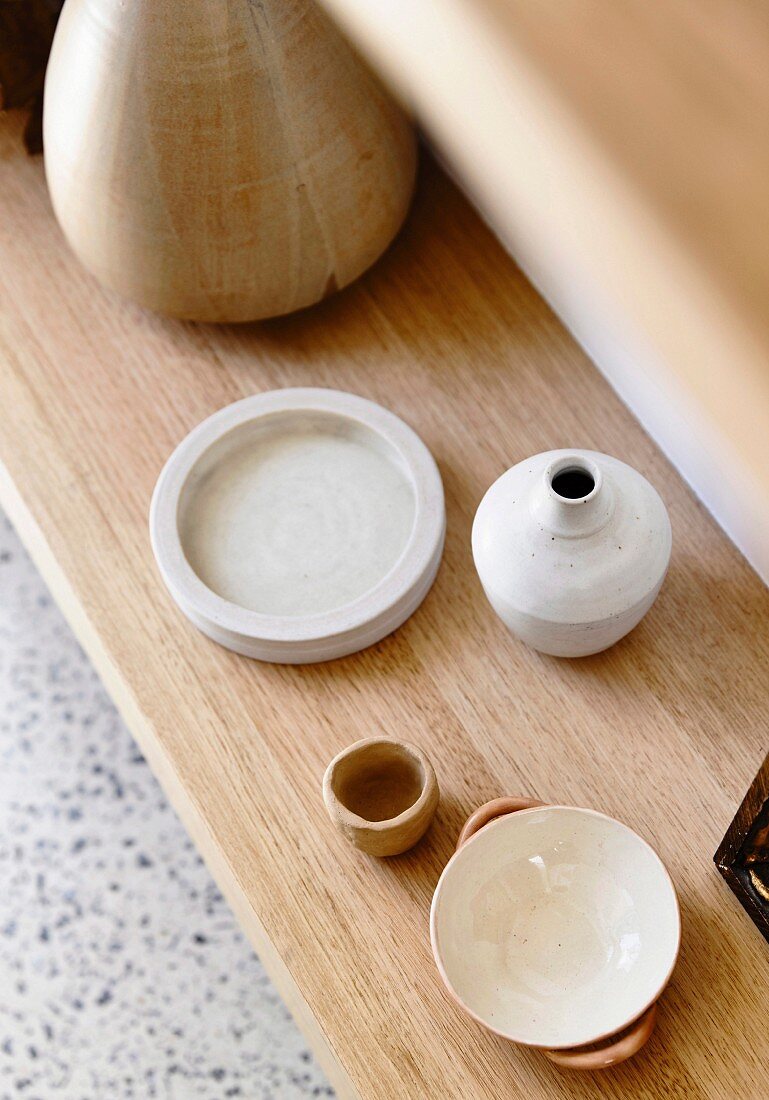 Noble ceramic vessels on a wooden background